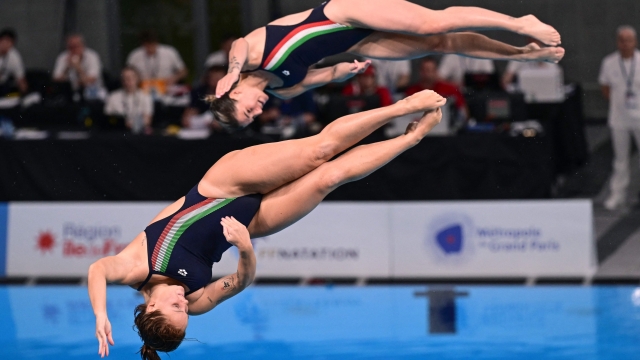 Italy's Elena Bertocchi(L) and Chiara Pellacani compete at Women's Synchronised 3m Springboard as part of a test event for the Paris 2024 Olympic Games at the Olympic Aquatic centre in Saint-Denis, north of Paris, on May 8, 2024. (Photo by MIGUEL MEDINA / AFP)