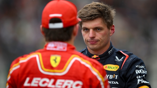 SPA, BELGIUM - JULY 27: Pole position qualifier Max Verstappen of the Netherlands and Oracle Red Bull Racing talks with Second placed qualifier Charles Leclerc of Monaco and Ferrari in parc ferme during qualifying ahead of the F1 Grand Prix of Belgium at Circuit de Spa-Francorchamps on July 27, 2024 in Spa, Belgium. (Photo by Rudy Carezzevoli/Getty Images)