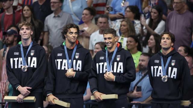 NANTERRE, FRANCE - JULY 27: Bronze Medalists, Alessandro Miressi, Thomas Ceccon, Paolo Conte Bonin and Manuel Frigo of Team Italy look on whilst wearing their medals during the Medal Ceremony after the Men's 4x100m Freestyle Relay Final on day one of the Olympic Games Paris 2024 at Paris La Defense Arena on July 27, 2024 in Nanterre, France. (Photo by Sarah Stier/Getty Images)
