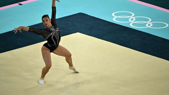 Italy's Manila Esposito competes in the floor exercise event of the artistic gymnastics women's qualification during the Paris 2024 Olympic Games at the Bercy Arena in Paris, on July 28, 2024. (Photo by Lionel BONAVENTURE / AFP)