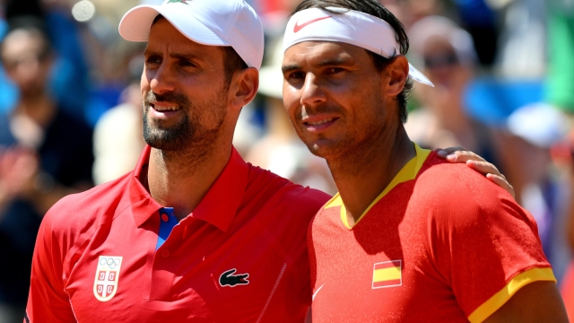 Rafael Nadal of Spain (R) and Novak Djokovic of Serbia during their Men's Singles second round match at the Tennis competitions in the Paris 2024 Olympic Games, at the Roland Garros in Paris, France, 29 July 2024. ANSA/ETTORE FERRARI