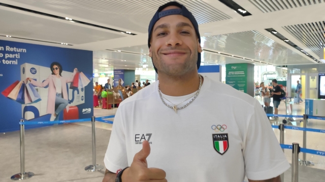 Marcell Jacobs of Italy gestures at Fiumicino Airport in Rome, 30 July 2024. Italian track and field sprinter will race at Olympic Games in Paris. ANSA/TELENEWS
