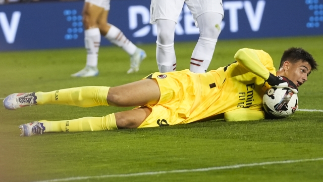 AC Milan goalkeeper Lorenzo Torriani makes a save against Real Madrid during the first half of a friendly soccer match Wednesday, July 31, 2024, in Chicago. (AP Photo/Erin Hooley)