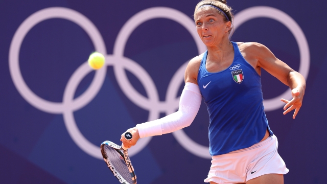 PARIS, FRANCE - JULY 28: Sara Errani of Team Italy plays a forehand against Qinwen Zhang of Team People's Republic of China during the Women?s Singles/ first round match on day two of the Olympic Games Paris 2024 at Roland Garros on July 28, 2024 in Paris, France. (Photo by Matthew Stockman/Getty Images)