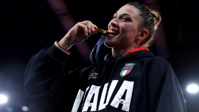 PARIS, FRANCE - AUGUST 01: Gold medalist Alice Bellandi of Team Italy celebrates off the podium during the Women -78 kg kg medal ceremony  on day six of the Olympic Games Paris 2024 at Champs-de-Mars Arena on August 01, 2024 in Paris, France. (Photo by Sarah Stier/Getty Images)