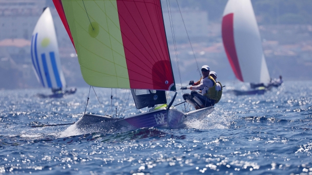 Spain's duo Diego Botin Le Chever and Florian Trittel Paul sail to win the gold medal at the end of the medal race of the mens 49er skiff event during the Paris 2024 Olympic Games sailing competition at the Roucas-Blanc Marina in Marseille on August 2, 2024. (Photo by Clement MAHOUDEAU / AFP)