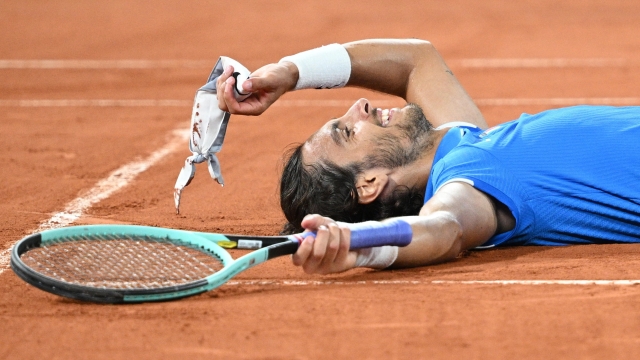 epa11523524 Lorenzo Musetti of Italy celebrates winning the Men's Singles bronze medal match against Felix Auger-Aliassime of Canada at the Tennis competitions in the Paris 2024 Olympic Games, at the Roland Garros in Paris, France, 03 August 2024.  EPA/CAROLINE BLUMBERG