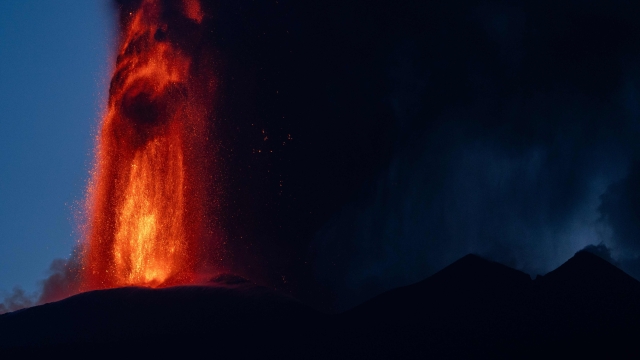 Lava spews from a crater of the Mount Etna volcano early on August 4, 2024 in Sicily. (Photo by Giuseppe Distefano / Etna Walk / AFP)