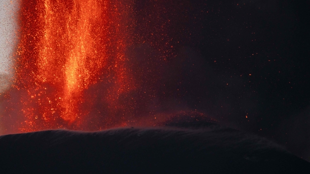 Lava spews from a crater of the Mount Etna volcano early on August 4, 2024 in Sicily. (Photo by Giuseppe Distefano / Etna Walk / AFP)