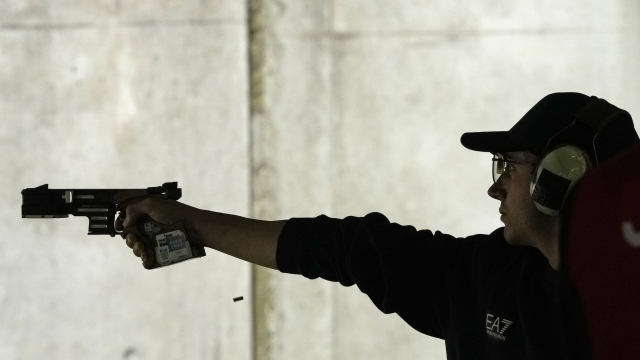 Italy's Massimo Spinella competes in the 25m rapid fire pistol men's qualification round at the 2024 Summer Olympics, Sunday, Aug. 4, 2024, in Chateauroux, France. (AP Photo/Manish Swarup)