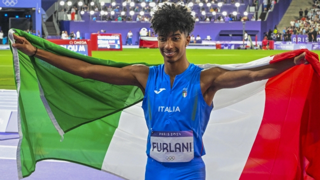 Mattia Furlani of Italy celebrates after placing third in the Men Long Jump final of the Athletics competitions in the Paris 2024 Olympic Games, at the Stade de France stadium in Saint Denis, France, 06 August 2024. ANSA/CIRO FUSCO