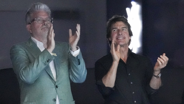 Actor TomActor Tom Cruise, right, watches swimming during the 2024 Summer Olympics, Saturday, July 27, 2024, in Nanterre, France.(AP Photo/Martin Meissner)