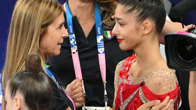 (L-R) Italian coach Eanuela Maccarani, Italian coach Claudia Mancinelli and Italy's Sofia Raffaeli react after the Individual All-Around final of the Rhythmic Gymnastics competitions in the Paris 2024 Olympic Games, at the La Chapelle Arena in Paris, France, 09 August 2024. ANSA/ETTORE FERRARI