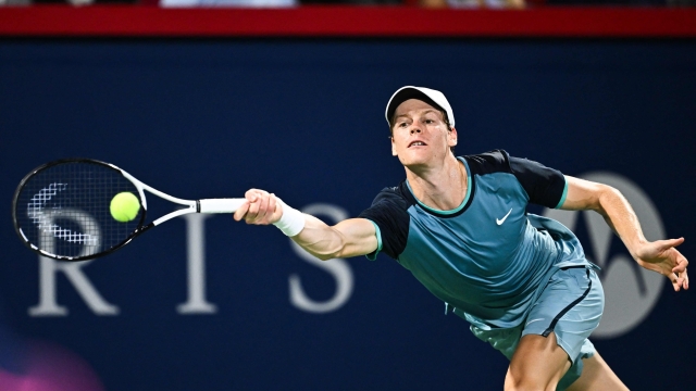 MONTREAL, CANADA - AUGUST 10: Jannik Sinner of Italy plays a forehand against Andrey Rublev in the Men's Singles quarterfinals round match during Day Five of the ATP Masters 1000 National Bank Open at Stade IGA on August 10, 2024 in Montreal, Canada.   Minas Panagiotakis/Getty Images/AFP (Photo by Minas Panagiotakis / GETTY IMAGES NORTH AMERICA / Getty Images via AFP)