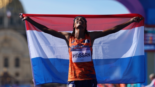 PARIS, FRANCE - AUGUST 11: Sifan Hassan of Team Netherlands celebrates after winning the Women's Marathon on day sixteen of the Olympic Games Paris 2024 at Esplanade Des Invalides on August 11, 2024 in Paris, France. (Photo by Cameron Spencer/Getty Images)