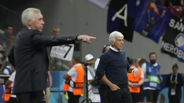 Atalanta's head coach Gian Piero Gasperini, right, and Real Madrid's head coach Carlo Ancelotti watch the UEFA Super Cup Final soccer match between Real Madrid and Atalanta at the Narodowy stadium in Warsaw, Poland, Wednesday, Aug. 14, 2024. (AP Photo/Czarek Sokolowski)