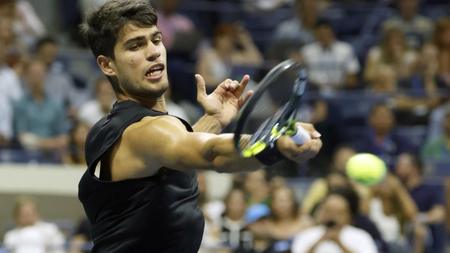 epa11568056 Carlos Alcaraz of Spain in action against Li Tu of Australia (not pictured) during their first round match at the US Open Tennis Championships at the USTA Billie Jean King National Tennis Center in Flushing Meadows, New York, USA, 27 August 2024. The US Open tournament runs from 26 August through 08 September.  EPA/JOHN G. MABANGLO