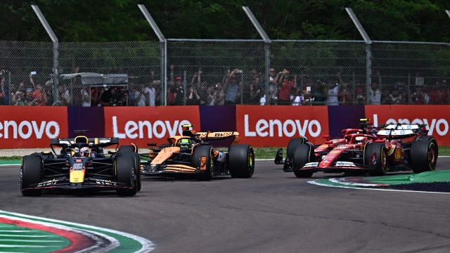 Red Bull Racing's Dutch driver Max Verstappen (L) and McLaren's British driver Lando Norris (2nd-L) compete during the Emilia Romagna Formula One Grand Prix at the Autodromo Enzo e Dino Ferrari race track in Imola on May 19, 2024. (Photo by GABRIEL BOUYS / AFP)