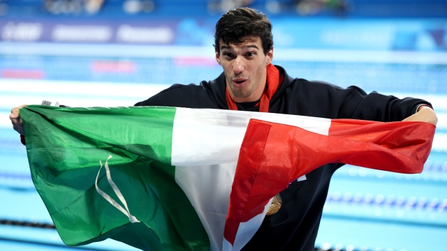 NANTERRE, FRANCE - SEPTEMBER 02: Gold medalist, Simone Barlaam of Team Italy, poses for a photo with their medal and national flag after the Men's 50m Freestyle - S9 Final on day five of the Paris 2024 Summer Paralympic Games at Paris La Defense Arena on September 02, 2024 in Nanterre, France. (Photo by Adam Pretty/Getty Images)