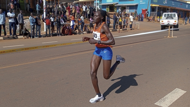 Rebecca Cheptegei, competes at the Discovery 10km road race in Kapchorwa, Uganda Friday, Jan. 20, 2023. A Cheptegei, a Ugandan athlete living in Kenya was set ablaze by her boyfriend on Sunday Sept. 1, 2024 and is currently receiving treatment for 75% burns, police said. (AP Photo)