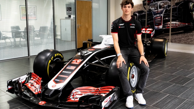 BANBURY, ENGLAND - JULY 03: Oliver Bearman of Great Britain and Haas F1 poses for a photo as he signs a deal for the 2025 season with Haas F1 during previews ahead of the F1 Grand Prix of Great Britain at Haas F1 Factory on July 03, 2024 in Banbury, England. (Photo by Getty Images/Getty Images)