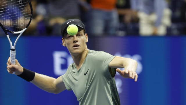 epaselect epa11585823 Jannik Sinner of Italy hits a ball up to the crowd after winning match point against Daniil Medvedev of Russia during their quarterfinals match at the US Open Tennis Championships at the USTA Billie Jean King National Tennis Center in Flushing Meadows, New York, USA, 04 September 2024. The US Open tournament runs from 26 August through 08 September.  EPA/JOHN G. MABANGLO