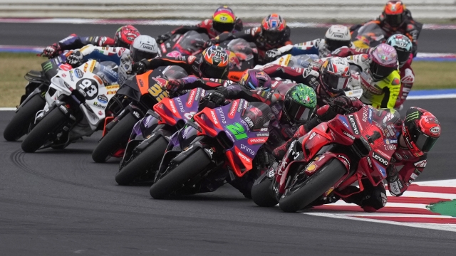 MotoGP rider Francesco Bagnaia of Italy leads into a curve during the first lap of the San Marino Motorcycle Grand Prix at the Misano circuit in Misano Adriatico, Italy, Sunday, Sept. 8, 2024. (AP Photo/Antonio Calanni)