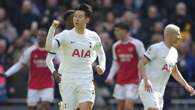 Tottenham's Son Heung-min celebrates after scoring his side's second goal from a penalty shot during the English Premier League soccer match between Tottenham Hotspur and Arsenal at the Tottenham Hotspur Stadium in London, England, Sunday, April 28, 2024. (AP Photo/Kin Cheung)