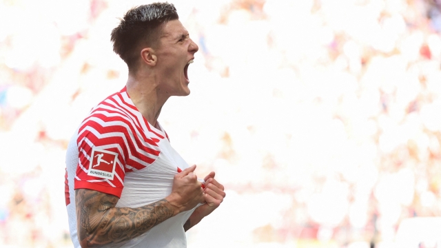 Leipzig's Slovenian forward #30 Benjamin Sesko celebrates scoring during the German first division Bundesliga football match between RB Leipzig and Werder Bremen in Leipzig, eastern Germany on May 11, 2024. (Photo by Ronny HARTMANN / AFP) / DFL REGULATIONS PROHIBIT ANY USE OF PHOTOGRAPHS AS IMAGE SEQUENCES AND/OR QUASI-VIDEO