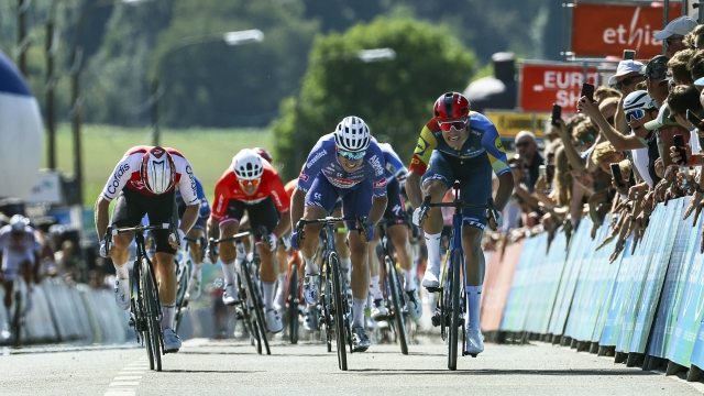 Italian Jonathan Milan of Lidl-Trek (R) wins the sprint, before Belgian Jasper Philipsen of Alpecin-Deceuninck (C) and French Axel Zingle of Cofidis (L), at the finish of the first stage of the 'Renewi Tour' multi-stage cycling race, from Riemst to Bilzen (163,6 km) on August 28, 2024. The five-day race takes place in Belgium and the Netherlands. (Photo by DAVID PINTENS / Belga / AFP) / Belgium OUT