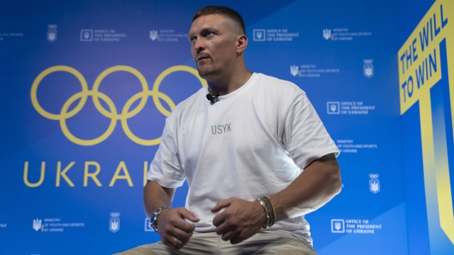 FILE - World Heavyweight boxing champion Oleksandr Usyk speaks during a visit to the Ukrainian House in Paris, France at the 2024 Summer Olympics, Monday, July 29, 2024. (AP Photo/Hanna Arhirova, File)