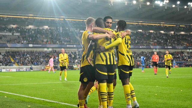 Dortmund´s players celebrate after winning the UEFA Champions League's 1st round day 1 football match between Club Brugge KV and Borussia Dortmund at the Jan Breydel Stadium in Bruges on September 18, 2024. (Photo by NICOLAS TUCAT / AFP)