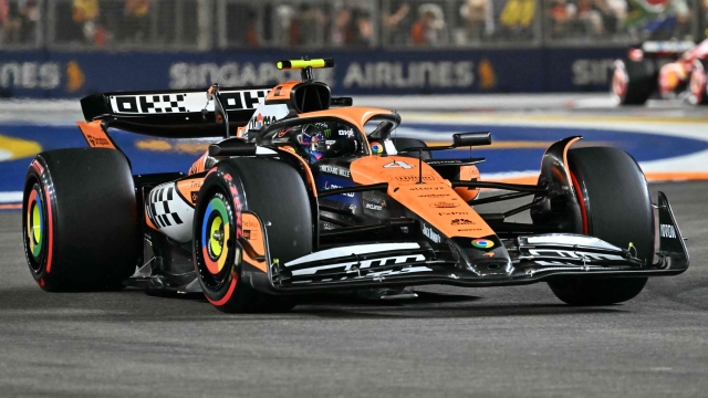 McLaren's British driver Lando Norris drives during the qualifying session ahead of the Formula One Singapore Grand Prix night race at the Marina Bay Street Circuit in Singapore on September 21, 2024. (Photo by ROSLAN RAHMAN / AFP)