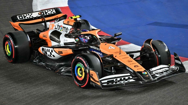 TOPSHOT - McLaren's British driver Lando Norris drives during the qualifying session ahead of the Formula One Singapore Grand Prix night race at the Marina Bay Street Circuit in Singapore on September 21, 2024. (Photo by ROSLAN RAHMAN / AFP)