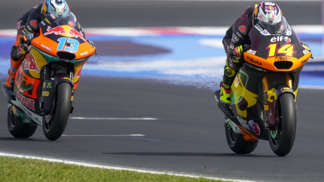 Italian rider Tony Arbolino of the ELF Marc VDS Racing Team steers his motorcycle followed by Italian rider Celestino Vietti of the Red Bull KTM Ajo during the Moto 2 race of the Emilia Romagna Motorcycle Grand Prix at the Misano circuit in Misano Adriatico, Italy, Sunday, Sept. 22, 2024. (AP Photo/Gregorio Borgia)