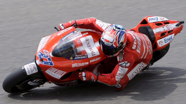 epa01745664 Australian Casey Stoner, of Ducati Marlboro Team, rides his Ducati during the first free practice to the upcoming Grand Prix of Italy on the Mugello race track, in Scarperia, Italy, 29 May 2009.  EPA/SALVATORE DI NOLFI