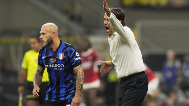 Inter Milan's head coach Simone Inzaghi, right, reacts during the Serie A soccer match between Inter Milan and AC Milan at the San Siro stadium in Milan, Italy, Sunday, Sept.22, 2024. (AP Photo/Luca Bruno)