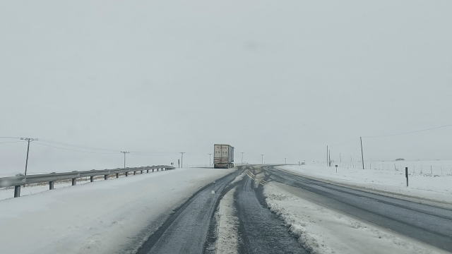 A general view of heavy snowfall on a road to Harrismith from Sterkfontein dam on September 21, 2024. Unusually heavy snowfall caused major disruption on South Africas roads on September 21 with people still stranded at midday after spending the night stuck in their vehicles. The key N3 highway linking Johannesburg and the east coast city of Durban was one of the worst affected and several portions were closed, with even detours impassible, officials said. (Photo by Grant Bruce Cameron-Ellis / AFP)