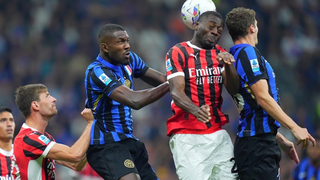 AC Milan's Youssouf Fofana ight for the ball with Inter Milan's Marcus Thuram during the Serie A soccer match between Inter and Milan at the San Siro Stadium in Milan, north Italy - Sunday, September  22 , 2024. Sport - Soccer . (Photo by Spada/Lapresse)