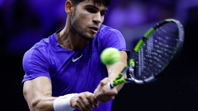 Spain's Carlos Alcaraz of Team Europe returns the ball to USA's Taylor Fritz of Team World during their 2024 Laver Cup men's singles tennis match in Berlin, Germany on September 22, 2024. (Photo by Odd ANDERSEN / AFP)