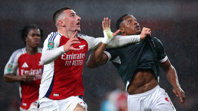 LONDON, ENGLAND - SEPTEMBER 25: Maldini Kacurri of Arsenal grabs the shirt of Victor Adeboyejo of Bolton Wanderers during the Carabao Cup Third Round match between Arsenal and Bolton Wanderers at Emirates Stadium on September 25, 2024 in London, England. (Photo by Alex Pantling/Getty Images)