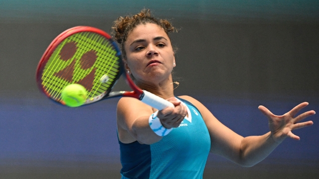 Italys Jasmine Paolini hits a return to Denmarks Clara Tauson during their women's singles match at the China Open tennis tournament in Beijing on September 28, 2024. (Photo by Jade Gao / AFP)