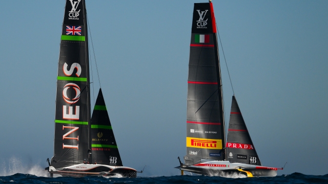 BARCELONA, SPAIN - SEPTEMBER 26: The AC75 Luna Rossa Prada Pirelli Team and the AC75 Ineos Britannia compete during the Louis Vuitton Cup Final Race 1 on September 26, 2024 in Barcelona, Spain. (Photo by David Ramos/Getty Images)