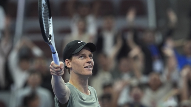 Jannick Sinner of Italy gestures to supporters after defeating Roman Safiullin of Russia during the China Open tennis tournament held at the National Tennis Center in Beijing, Saturday, Sept. 28, 2024. (AP Photo/Ng Han Guan)