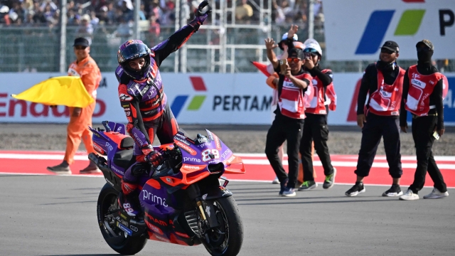 TOPSHOT - First-placed Prima Pramac Racing's Spanish rider Jorge Martin celebrates after winning the MotoGP race of the Indonesian Grand Prix at the Mandalika International Circuit in Mandalika, West Nusa Tenggara on September 29, 2024. (Photo by BAY ISMOYO / AFP)