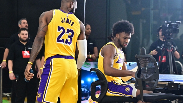 Los Angeles Lakers #23 LeBron James and his son #9 Bronny James attend the Lakers media day at UCLA Health Training Center in El Segundo, California, September 30, 2024. (Photo by Frederic J. BROWN / AFP)