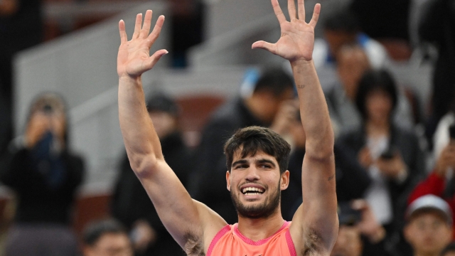 Spains Carlos Alcaraz celebrates after winning his mens singles semi-final match against Russias Daniil Medvedev  at the China Open tennis tournament in Beijing on October 1, 2024. (Photo by GREG BAKER / AFP)