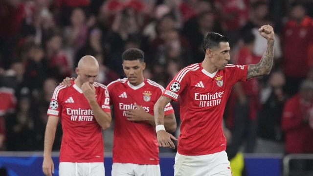 Benfica's Angel Di Maria, right, celebrates after scoring his sides second goal with a penalty kick during a Champions League opening phase soccer match between SL Benfica and Atletico Madrid in Lisbon, on Wednesday, Oct. 2, 2024.(AP Photo/Armando Franca)