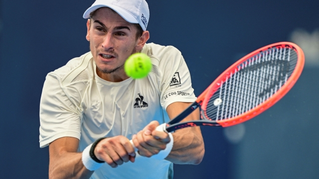 CORRECTION / Italy's Matteo Arnaldi hits a return to Tommy Paul of the US during their men's singles match at the Japan Open tennis tournament at Ariake Coliseum in Tokyo on September 26, 2024. (Photo by Yuichi YAMAZAKI / AFP) / The erroneous mention[s] appearing in the metadata of this photo by Yuichi YAMAZAKI has been modified in AFP systems in the following manner: [September 26] instead of [September 25]. Please immediately remove the erroneous mention[s] from all your online services and delete it (them) from your servers. If you have been authorized by AFP to distribute it (them) to third parties, please ensure that the same actions are carried out by them. Failure to promptly comply with these instructions will entail liability on your part for any continued or post notification usage. Therefore we thank you very much for all your attention and prompt action. We are sorry for the inconvenience this notification may cause and remain at your disposal for any further information you may require.