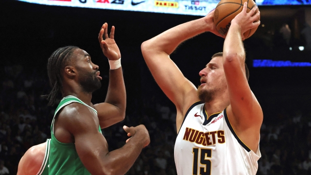 Denver Nuggets' center #15 Nikola Jokic jumps to shoot during the NBA Preseason game between the Denver Nuggets and the Boston Celtics at the Etihad Arena in Abu Dhabi on October 4, 2023. (Photo by Fadel Senna / AFP)